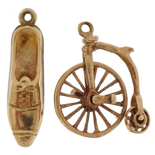 2138 - Two 9ct gold charms comprising penny farthing and shoe, the largest 2cm high, total 2.1g