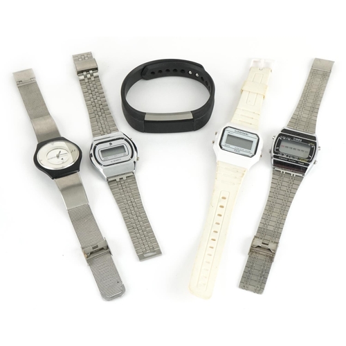 2579 - Four vintage and later wristwatches and Fitbit including Timex Chrono alarm timer and Olympus