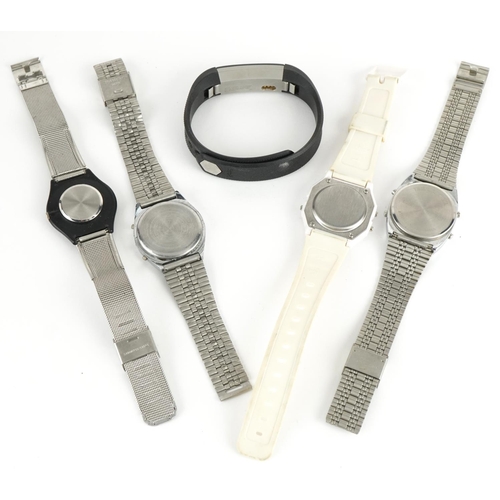 2579 - Four vintage and later wristwatches and Fitbit including Timex Chrono alarm timer and Olympus