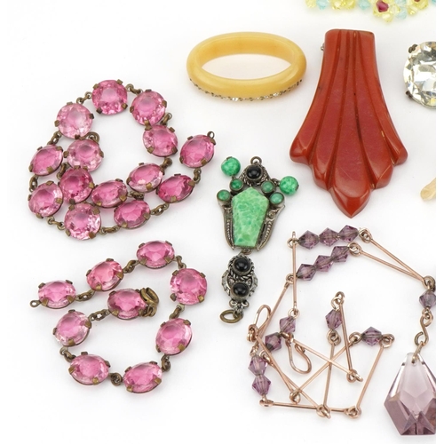 2572 - Vintage and later jewellery including pink stone necklaces, paste necklace and Art Deco Bakelite cli... 