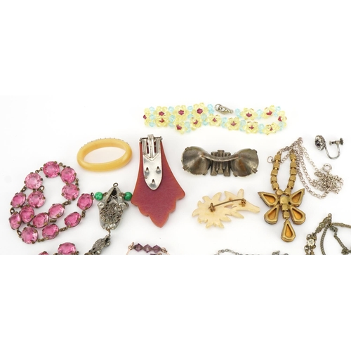 2572 - Vintage and later jewellery including pink stone necklaces, paste necklace and Art Deco Bakelite cli... 