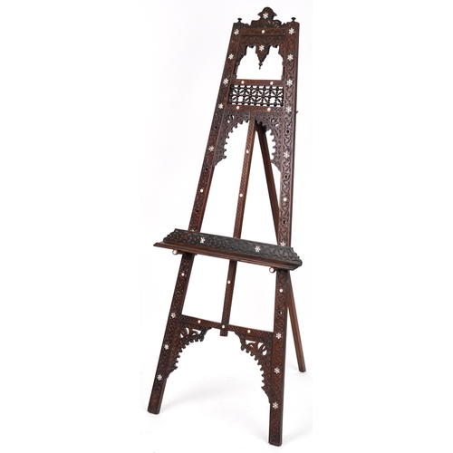 1084 - Attributed to Liberty & Co, Moorish hardwood floor standing easel with mother of pearl inlay profuse... 