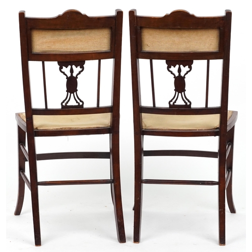 1153 - Four Edwardian inlaid mahogany salon chairs including two carvers, the largest each 90cm high