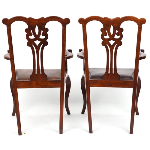 1128 - Pair of early 19th century carver chairs with leather upholstered seats, 99.5cm high