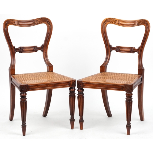 1097 - Pair of Edwardian walnut hall chairs with cane seats, 83cm high