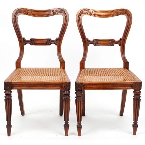 1097 - Pair of Edwardian walnut hall chairs with cane seats, 83cm high