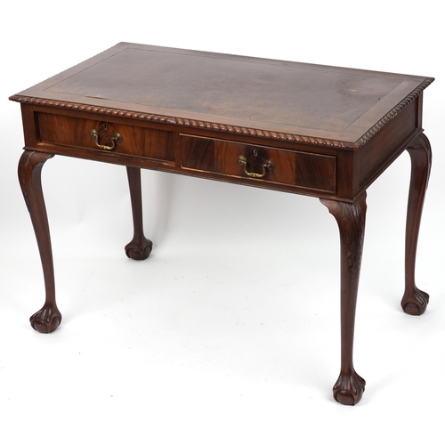 1067 - Edwardian mahogany writing table with two frieze drawers on ball and claw feet, 77cm H x 107cm W x 6... 