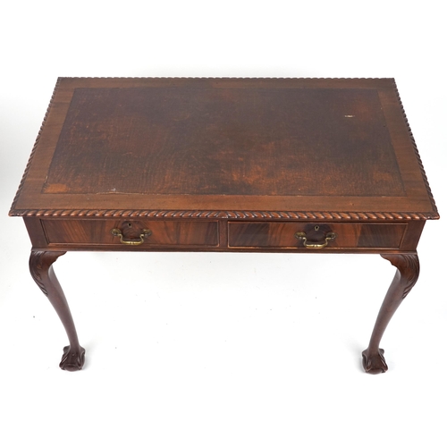 1067 - Edwardian mahogany writing table with two frieze drawers on ball and claw feet, 77cm H x 107cm W x 6... 