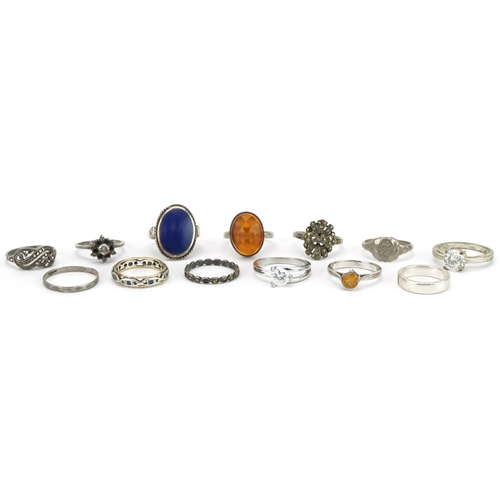 2599 - Twelve silver and white metal rings and a 9ct gold and silver eternity ring, some set with semi prec... 