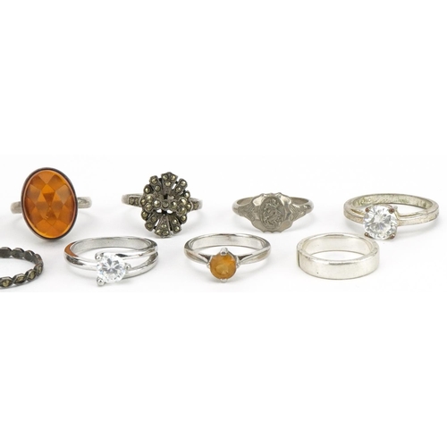 2599 - Twelve silver and white metal rings and a 9ct gold and silver eternity ring, some set with semi prec... 