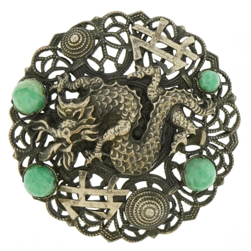 2063 - Chinese white metal dragon brooch set with jade cabochons, 4.5cm in diameter, 10.5g