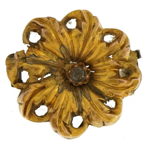 2160 - Antique yellow metal flower head set with a clear stone, 2.2cm in diameter, 2.2g