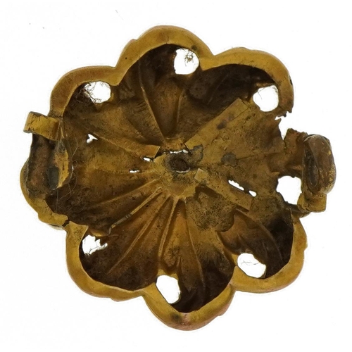 2160 - Antique yellow metal flower head set with a clear stone, 2.2cm in diameter, 2.2g