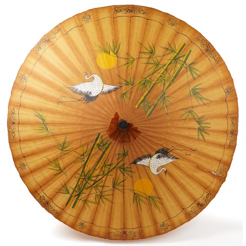 1536 - Chinese bamboo parasol hand painted with a bird amongst flowers, 208cm high