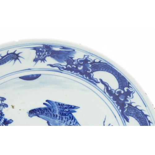 57 - Chinese blue and white porcelain shallow dish hand painted with a falcon amongst flowers and dragons... 