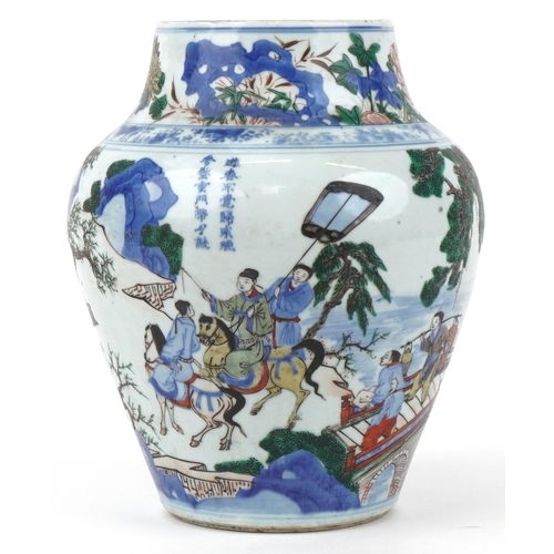 11 - Large Chinese wucai porcelain vase hand painted with a figure on horseback and attendants crossing a... 
