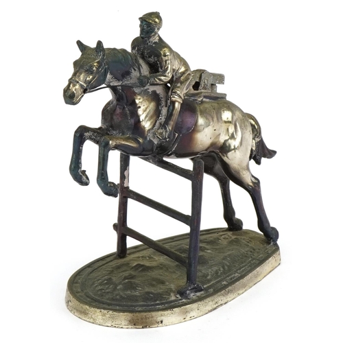 1588 - Novelty silver plated table lighter in the form of a jockey on horseback, 15.5cm high