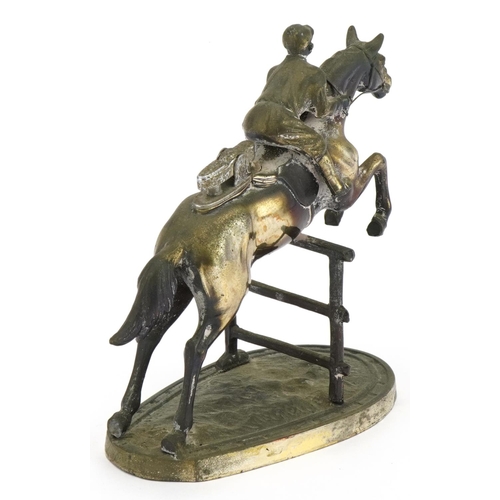 1588 - Novelty silver plated table lighter in the form of a jockey on horseback, 15.5cm high