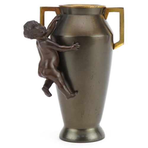 407 - Aesthetic style bronzed vase with twin handles surmounted with a nude bronze child, 16cm high