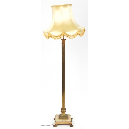 1110 - Early 20th century gilt brass column standard lamp with silk lined shade and onyx and brass base on ... 