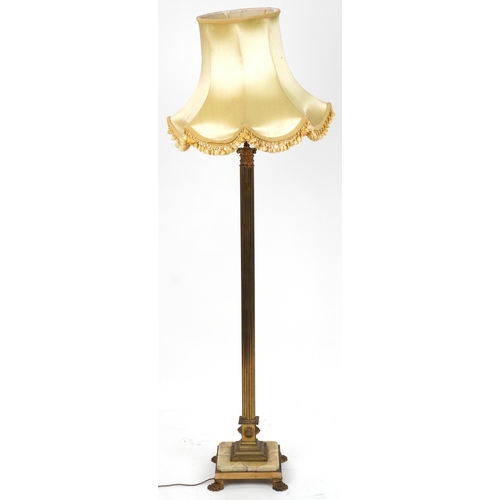 1110 - Early 20th century gilt brass column standard lamp with silk lined shade and onyx and brass base on ... 