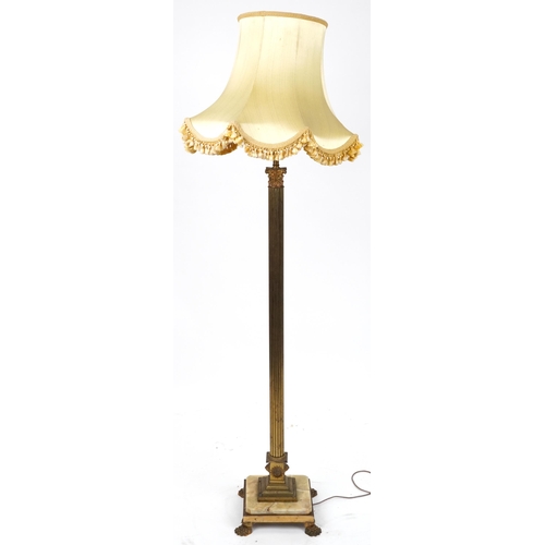 1110 - Early 20th century gilt brass column standard lamp with silk lined shade and onyx and brass base on ... 