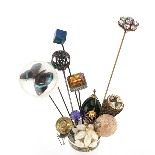 172 - Early 20th century and later hatpins, some silver, together with two hatpin stands, one silver, the ... 