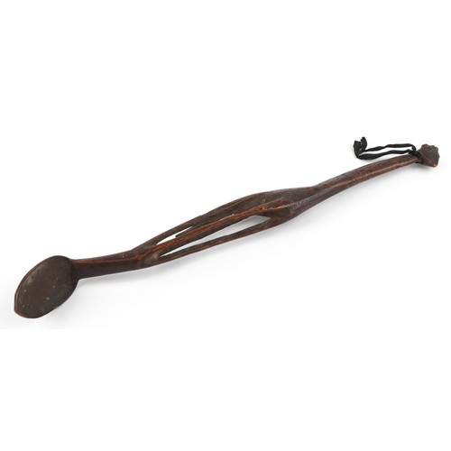 1594 - Large tribal interest treen spoon carved with a giraffe, 55cm in length