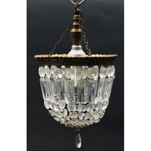 1336 - Three ornate brass bag chandeliers with cut glass drops including a pair, the pair each 38cm high