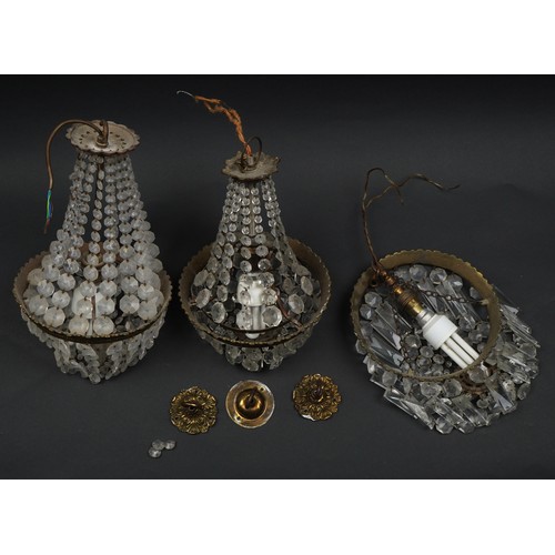 1336 - Three ornate brass bag chandeliers with cut glass drops including a pair, the pair each 38cm high