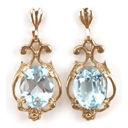 2128 - Pair of unmarked gold aquamarine drop earrings, the butterflies marked 375, 2.4cm high, 2.6g