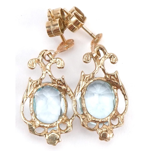 2128 - Pair of unmarked gold aquamarine drop earrings, the butterflies marked 375, 2.4cm high, 2.6g