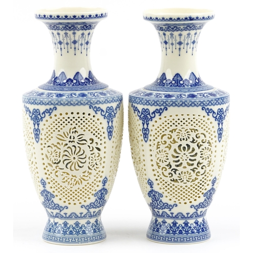 1829 - Chinese blue and white porcelain reticulated two piece flower vases decorated with flowers and child... 