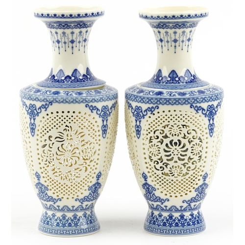 1829 - Chinese blue and white porcelain reticulated two piece flower vases decorated with flowers and child... 