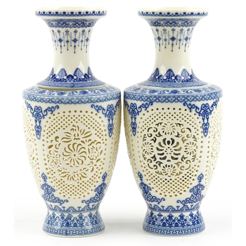 1829 - Chinese blue and white porcelain reticulated two piece flower vases decorated with flowers and child... 