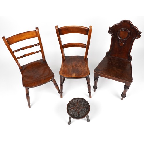 1037 - Antique occasional furniture comprising three chairs and a carved oak three footed stool, the larges... 