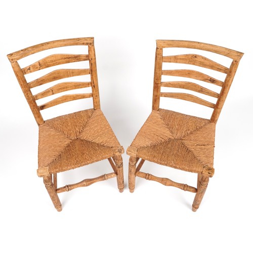 1035 - Pair of antique lightwood chairs with rush seats, each 93cm high