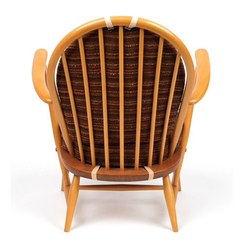 1033 - Ercol Windsor light elm armchair, 83.5cm high