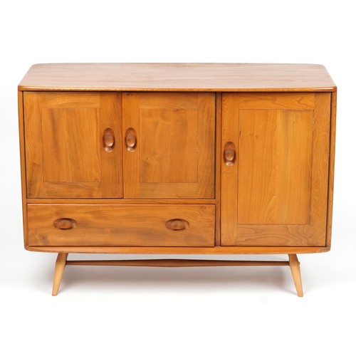 1031 - Ercol Windsor light elm sideboard fitted with three cupboard doors and drawer, 81.5cm H x 114cm W x ... 