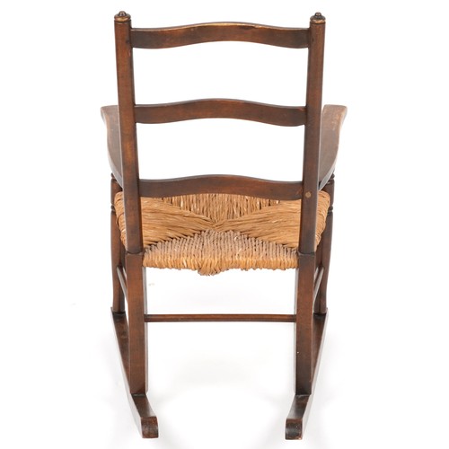 1040 - Antique mahogany childs rocking chair with rush seat, 67cm high