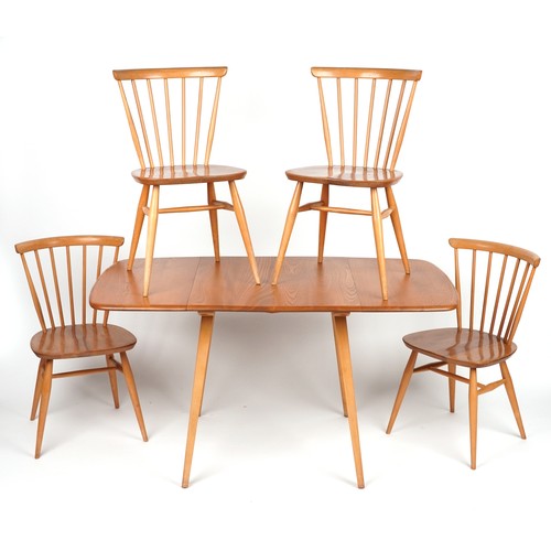 1032 - Ercol light elm dining table with four stick back chairs, the table 72cm H x 136.5cm W x 75cm D when... 