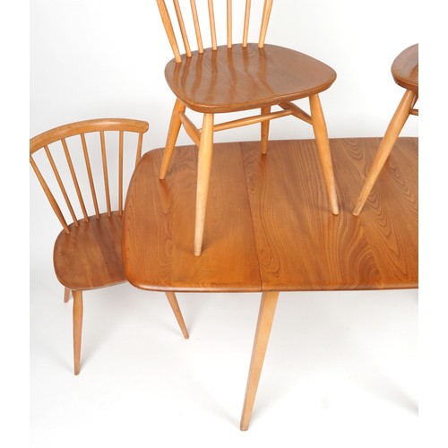 1032 - Ercol light elm dining table with four stick back chairs, the table 72cm H x 136.5cm W x 75cm D when... 