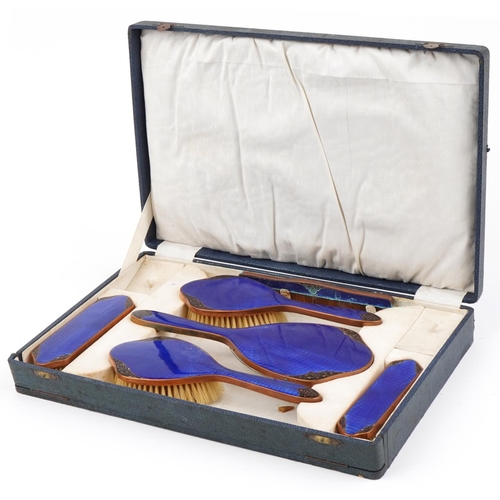 477 - Early 20th century brass blue guilloche and black enamel foliate dressing table set with fitted case... 