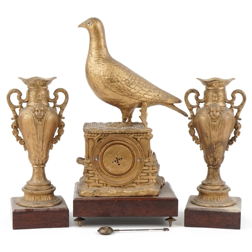 295 - 19th century continental gilt metal grouse design mantle clock with garniture vases, each raised on ... 