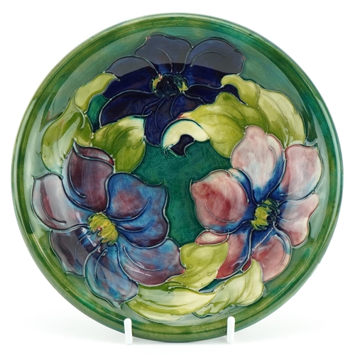 330 - William Moorcroft pottery plate hand painted in the Clematis green pattern, paper label, signature a... 