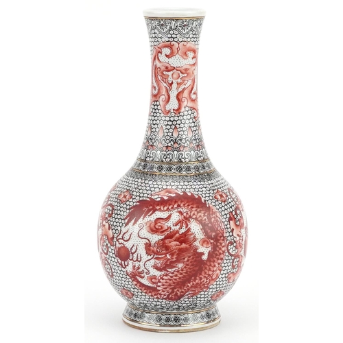 2400 - Chinese porcelain vase hand painted in iron red with roundels of a phoenix and dragons, six figure c... 