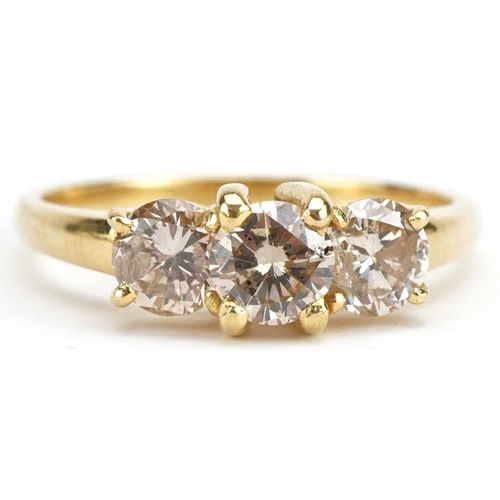 8 - Unmarked gold diamond three stone ring, tests as 18ct gold, total diamond weight approximately 1.80 ... 