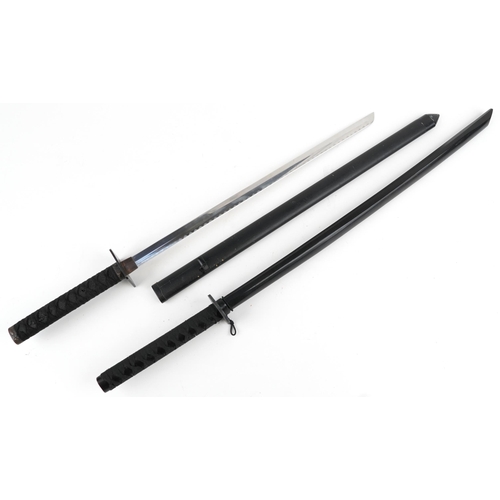 1460 - Japanese Samurai sword and a training example, the largest 100.5cm in length