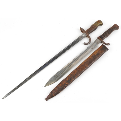 1415 - German military World War II sawback bayonet with scabbard by J H Becker and a French bayonet, the l... 