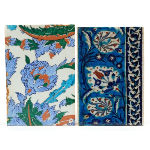 276 - Two Turkish Ottoman Iznik pottery tiles hand painted with flowers, the largest 24cm x 17cm